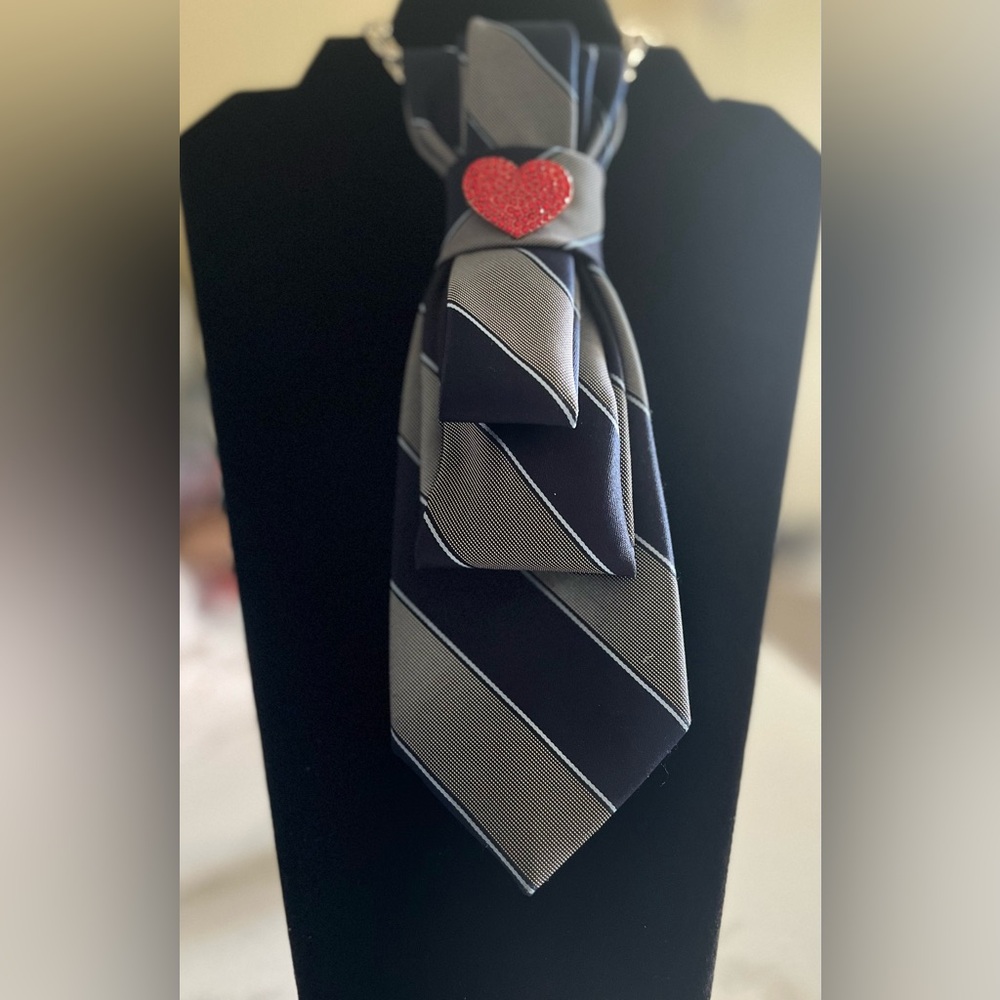 Classic Black and Gray Striped Tie necklace with a red jeweled heart brooch..